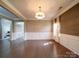 Dining room with hardwood floors, detailed trim and an entrance into the kitchen at 120 Autumn Mist Rd, Statesville, NC 28677