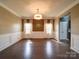 Bright dining room features a hardwood floor, wainscoting and decorative trim at 120 Autumn Mist Rd, Statesville, NC 28677
