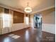Dining room with a hardwood floor, large windows and detailed trim work at 120 Autumn Mist Rd, Statesville, NC 28677