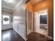 Entryway with decorative wainscoting leading to full bathroom with shower and tub at 120 Autumn Mist Rd, Statesville, NC 28677