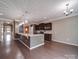 Open kitchen featuring granite countertops, stainless steel appliances, and hardwood floors at 120 Autumn Mist Rd, Statesville, NC 28677