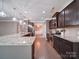 Kitchen featuring granite countertops, stainless steel appliances, and hardwood floors at 120 Autumn Mist Rd, Statesville, NC 28677