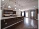 Open concept kitchen with large island, granite countertops, stainless steel appliances and pendant lighting at 120 Autumn Mist Rd, Statesville, NC 28677