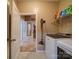 Convenient laundry room with modern washer and dryer and overhead shelving for supplies at 120 Autumn Mist Rd, Statesville, NC 28677