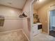Practical laundry room with washer, dryer, wire shelving, and storage space at 120 Autumn Mist Rd, Statesville, NC 28677