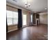 Open floor plan living room with hardwood flooring, white trim and plenty of natural light at 120 Autumn Mist Rd, Statesville, NC 28677
