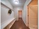 Charming mudroom with a bench, coat hooks, and hardwood floor at 120 Autumn Mist Rd, Statesville, NC 28677
