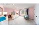 Bright bedroom with a large window, a comfortable bed, and a cozy reading chair at 125 Asmodean Ln, Troutman, NC 28166