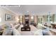 Bright and airy living room with fireplace, hardwood flooring, and dining area access at 125 Asmodean Ln, Troutman, NC 28166