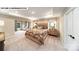 Main bedroom suite boasts tray ceilings, neutral tones, sitting area and ample natural light at 125 Asmodean Ln, Troutman, NC 28166