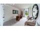 Bright home office with natural light, neutral paint, decor and comfortable seating at 125 Asmodean Ln, Troutman, NC 28166