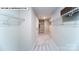 A spacious walk-in closet featuring ample shelving and neutral carpet, perfect for organization at 125 Asmodean Ln, Troutman, NC 28166