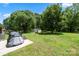 Spacious backyard with mature trees and an outdoor storage shed at 128 Wandering Ln, Bessemer City, NC 28016