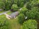 Spacious backyard featuring a well-maintained lawn, mature trees, and a private setting, perfect for outdoor living at 128 Wandering Ln, Bessemer City, NC 28016