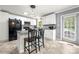 Bright kitchen with white cabinets, granite countertops, a center island, and stainless-steel appliances at 128 Wandering Ln, Bessemer City, NC 28016