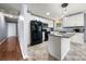 This spacious kitchen features an island and modern appliances with white cabinetry at 128 Wandering Ln, Bessemer City, NC 28016