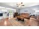 Spacious living room with hardwood floors and a view to the kitchen with granite countertops and stainless appliances at 128 Wandering Ln, Bessemer City, NC 28016