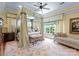 Beautiful bedroom with a canopy bed, patterned rug, and an abundance of natural light at 13837 Grand Palisades Pkwy, Charlotte, NC 28278