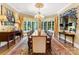 Elegant dining room with large windows, chandelier, and hardwood floors at 13837 Grand Palisades Pkwy, Charlotte, NC 28278
