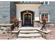 Inviting front entrance with double doors, stone steps, and decorative planters at 13837 Grand Palisades Pkwy, Charlotte, NC 28278