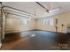 Spacious two-car garage with sealed floor, windows, and automatic door at 13837 Grand Palisades Pkwy, Charlotte, NC 28278