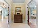 Hallway with an antique chest, offering views into the bathroom and bedroom at 13837 Grand Palisades Pkwy, Charlotte, NC 28278