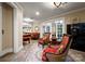 Elegant living room area with comfortable seating, a pool table and refined accents throughout at 13837 Grand Palisades Pkwy, Charlotte, NC 28278