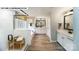 Bright bathroom featuring dual vanities, a walk-in shower, and separate soaking tub at 144 Asmodean Ln, Troutman, NC 28166