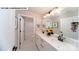 Bright bathroom with dual sinks, white countertops, and a shower/tub combo at 144 Asmodean Ln, Troutman, NC 28166