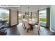 Dining room with large windows, elegant table, and chairs, creating a welcoming space for meals at 144 Asmodean Ln, Troutman, NC 28166