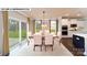 Dining room with sliding glass door, connecting seamlessly to the outdoors, adjacent to a modern kitchen at 144 Asmodean Ln, Troutman, NC 28166