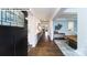 Bright foyer with hardwood floors, stylish decor, and a view into the dining area at 144 Asmodean Ln, Troutman, NC 28166