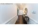 Elegant foyer featuring hardwood floors, decorative wainscoting, and a console table at 144 Asmodean Ln, Troutman, NC 28166