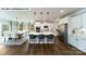 Well-lit kitchen with an island, stainless steel appliances, and an adjacent dining area at 144 Asmodean Ln, Troutman, NC 28166