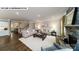 Open-concept living room with hardwood floors, stone fireplace, and staircase, providing ample space for Gathering at 144 Asmodean Ln, Troutman, NC 28166