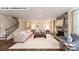 Spacious living room with a cozy stone fireplace and elegant decor, perfect for relaxing and entertaining at 144 Asmodean Ln, Troutman, NC 28166