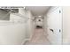 Long walk-in closet with shelving units and carpeted floor, great for storage at 144 Asmodean Ln, Troutman, NC 28166