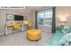 Inviting bonus room with a large window, desk, couch, and ample natural light at 146 Asmodean Ln, Troutman, NC 28166