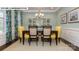 Formal dining room showcasing a stylish table setting, decorative curtains, and elegant display cabinets at 146 Asmodean Ln, Troutman, NC 28166