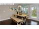 Bright dining room features modern table with bench seating and natural light at 146 Asmodean Ln, Troutman, NC 28166