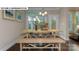 Formal dining room with wood floors, decorative art and bright lighting at 146 Asmodean Ln, Troutman, NC 28166