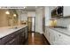 Spacious kitchen featuring stainless appliances, granite countertops, and dark hardwood floors at 146 Asmodean Ln, Troutman, NC 28166