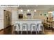 Modern kitchen with stainless steel appliances, a large island with seating, and hardwood flooring at 146 Asmodean Ln, Troutman, NC 28166
