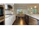Bright kitchen with stainless steel appliances, granite countertops, and an adjacent eat-in area at 146 Asmodean Ln, Troutman, NC 28166