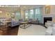 Bright living room with a fireplace and view of the dining area at 146 Asmodean Ln, Troutman, NC 28166