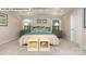 Bright main bedroom with tray ceiling, large windows, and decorative lamps and pillows at 146 Asmodean Ln, Troutman, NC 28166