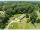 A tranquil aerial view of a home with verdant trees and expansive green lawns at 151 Lillyfield Dr, Rockwell, NC 28138