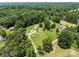 A scenic aerial view of a home with beautiful landscaping and mature trees at 151 Lillyfield Dr, Rockwell, NC 28138