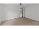 A large, empty bedroom featuring neutral carpeting and bright white walls at 151 Lillyfield Dr, Rockwell, NC 28138