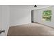 A bright bedroom featuring clean, white walls, carpet, and natural light at 151 Lillyfield Dr, Rockwell, NC 28138